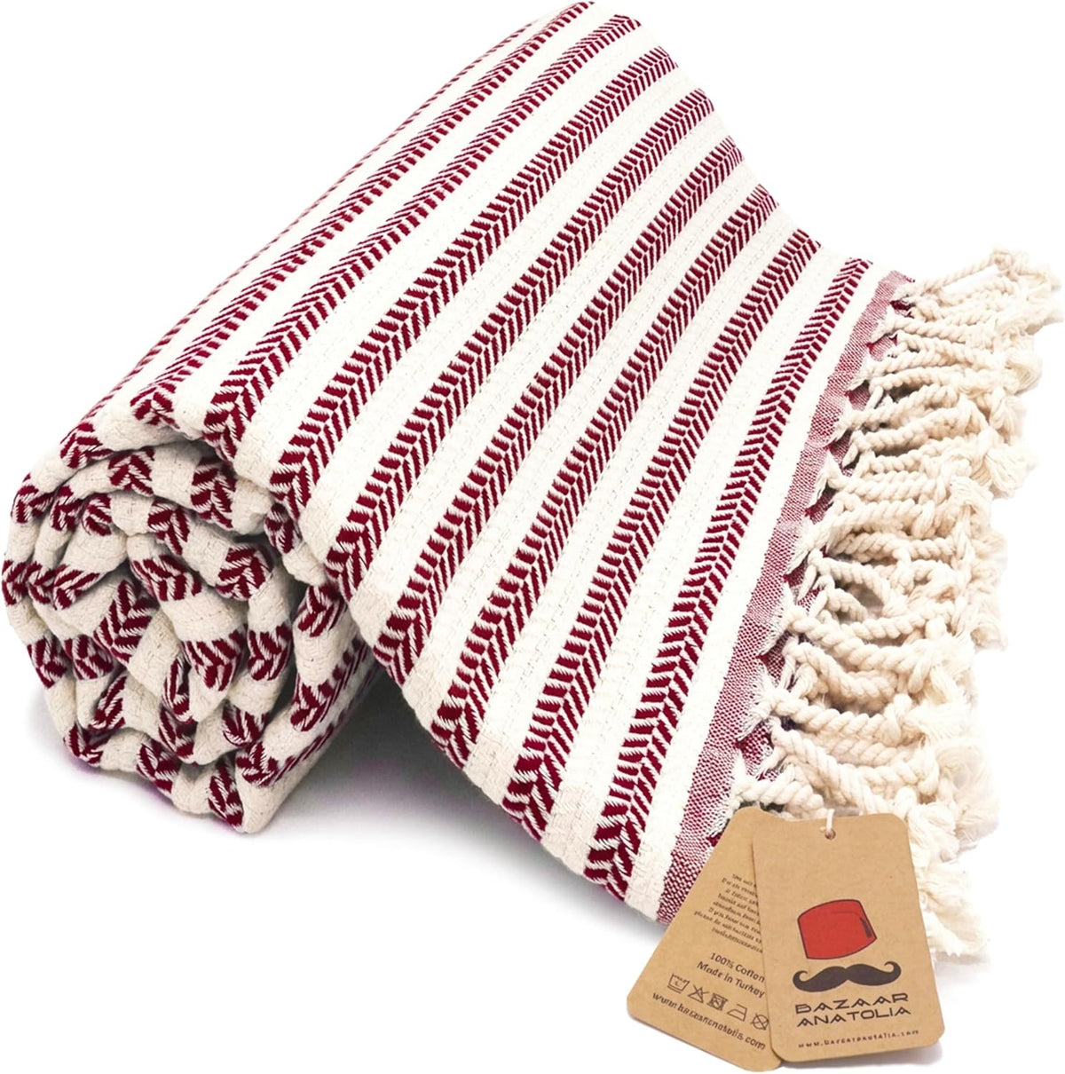 Maroon Arpa Turkish cotton beach towel with woven stripes and tasseled ends.