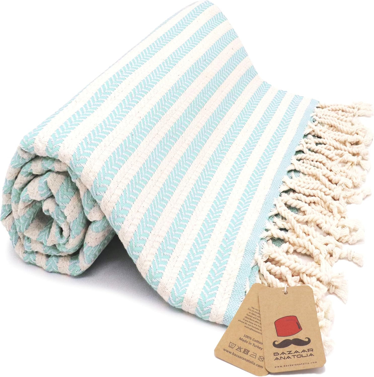 Mint Arpa Turkish cotton beach towel with woven stripes and tasseled ends.