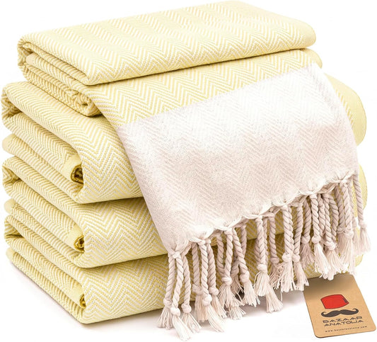 Set of four yellow herringbone Turkish cotton hand towels