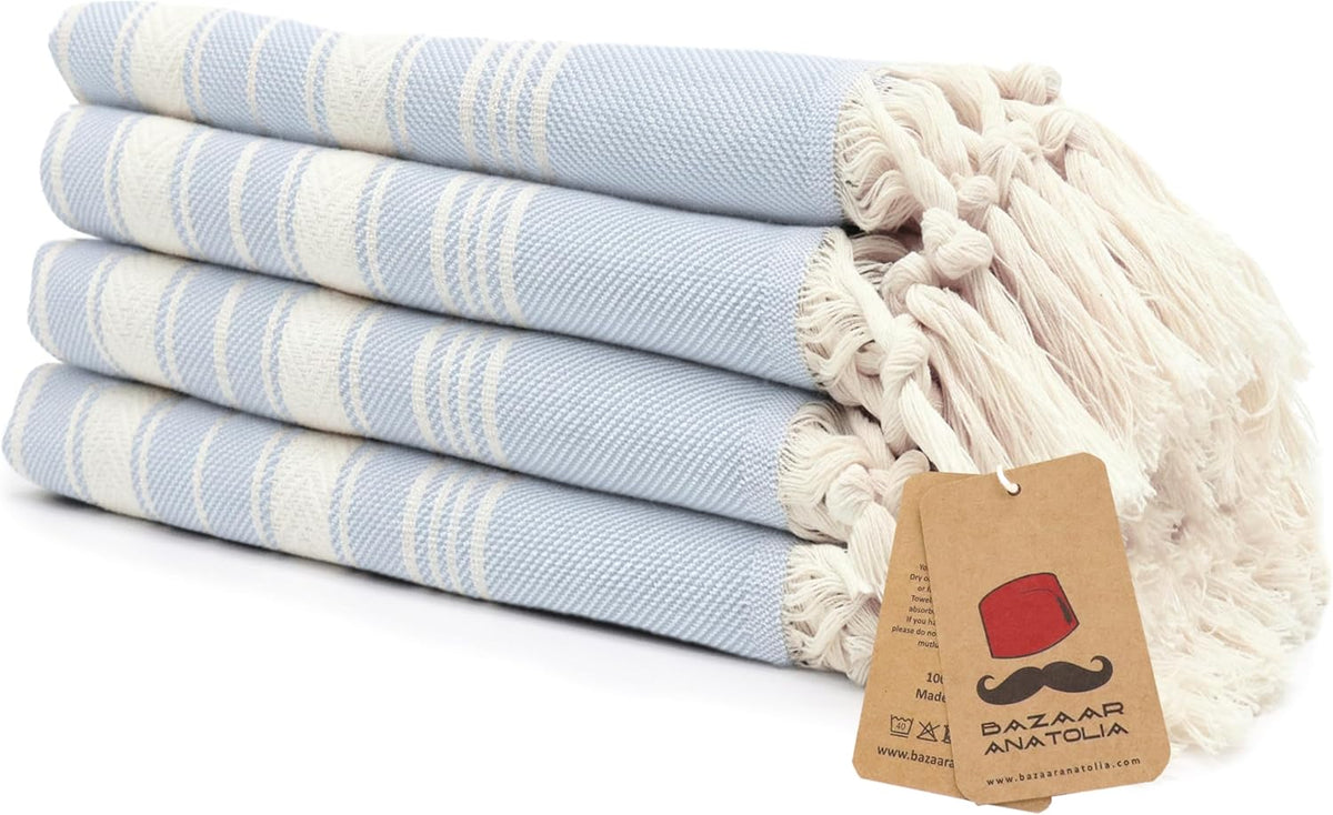 Set of four light blue Stripe Turkish cotton hand towels with tasseled ends.