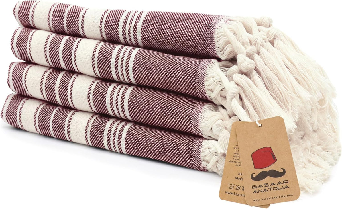 Set of four maroon Stripe Turkish cotton hand towels with tasseled ends.