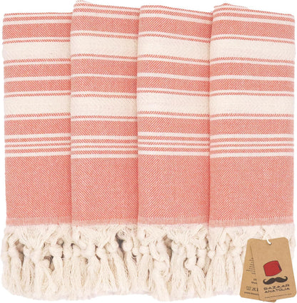 Set of four orange Stripe Turkish cotton hand towels with tasseled ends.