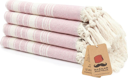 Set of four pink Stripe Turkish cotton hand towels with tasseled ends.
