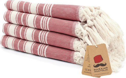 Set of four red Stripe Turkish cotton hand towels with tasseled ends.