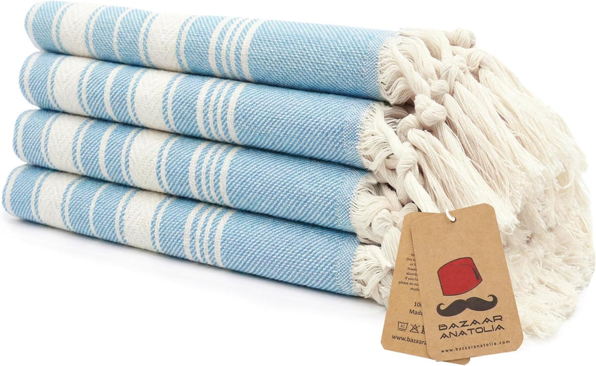 Set of four turquoise Stripe Turkish cotton hand towels with tasseled ends.