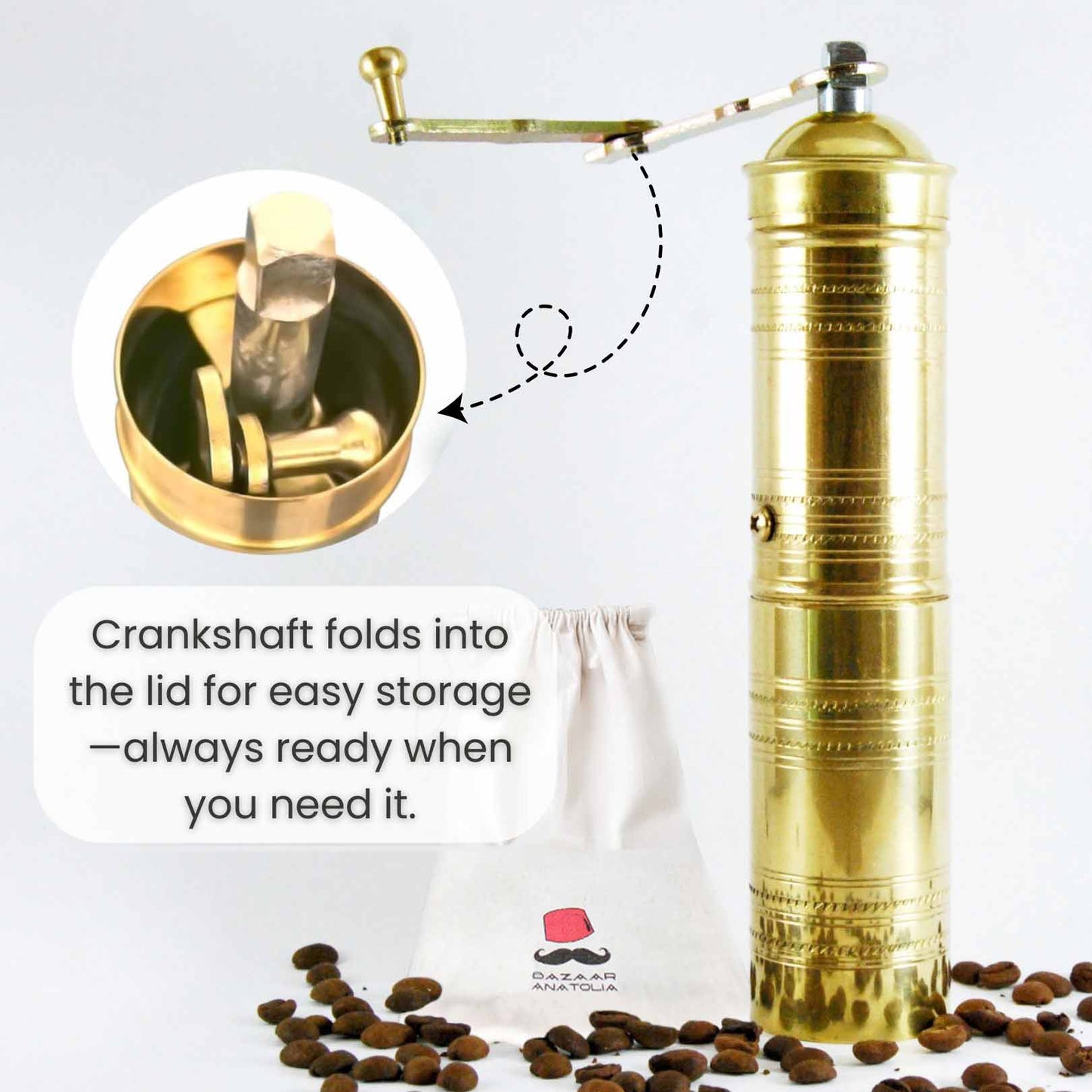 Brass Turkish coffee grinder with a foldable crankshaft neatly stored inside the lid, designed for easy storage and portability, shown with coffee beans and a branded Bazaar Anatolia storage pouch.